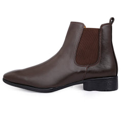 Brown leather Chelsea boot on a white background