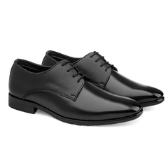 Pair of black dress shoes on a white background