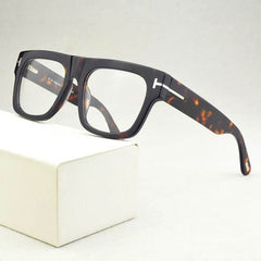Stylish black square frame eyeglasses online with a tortoiseshell accent on the sides.