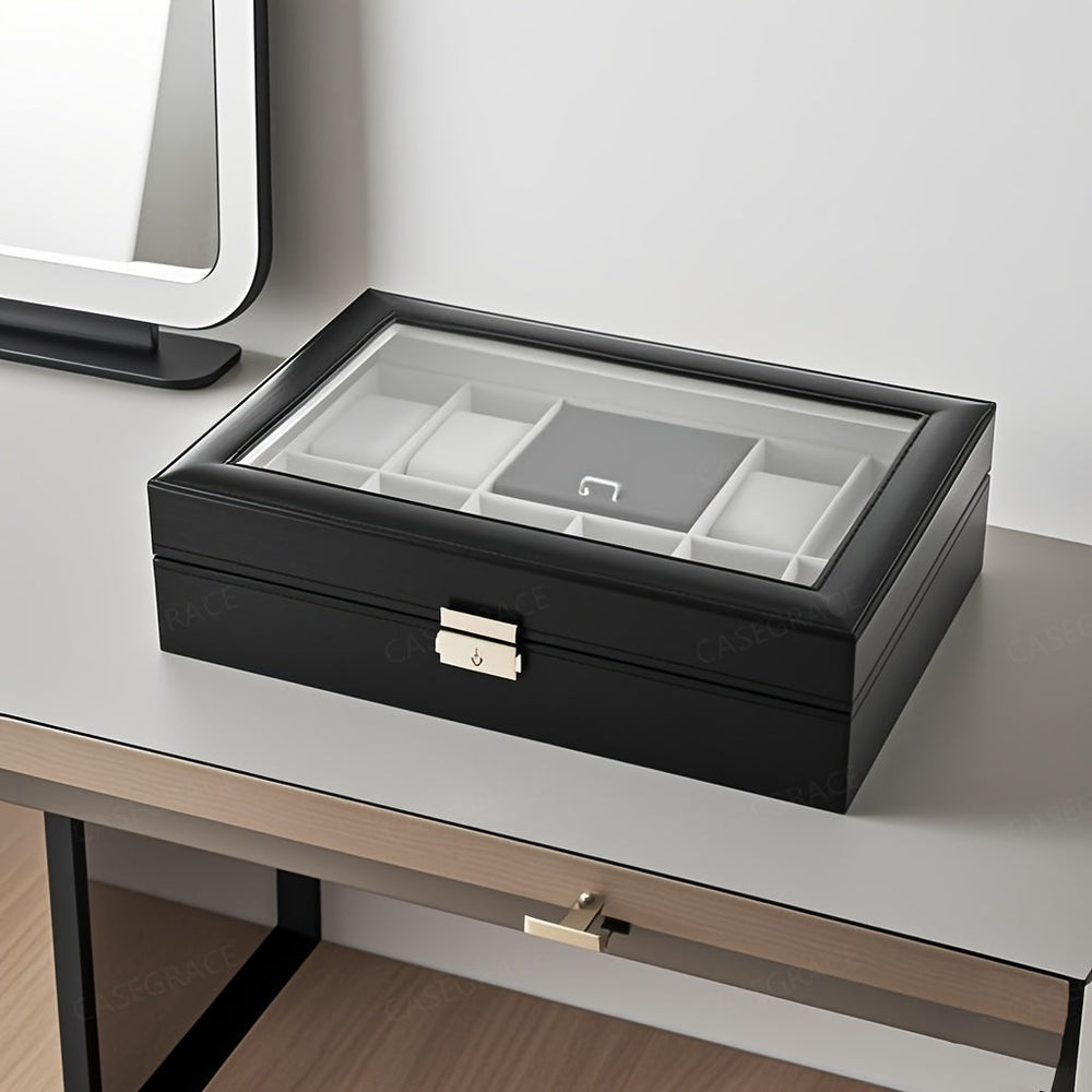 Black jewelry box on a vanity table with a mirror in the background