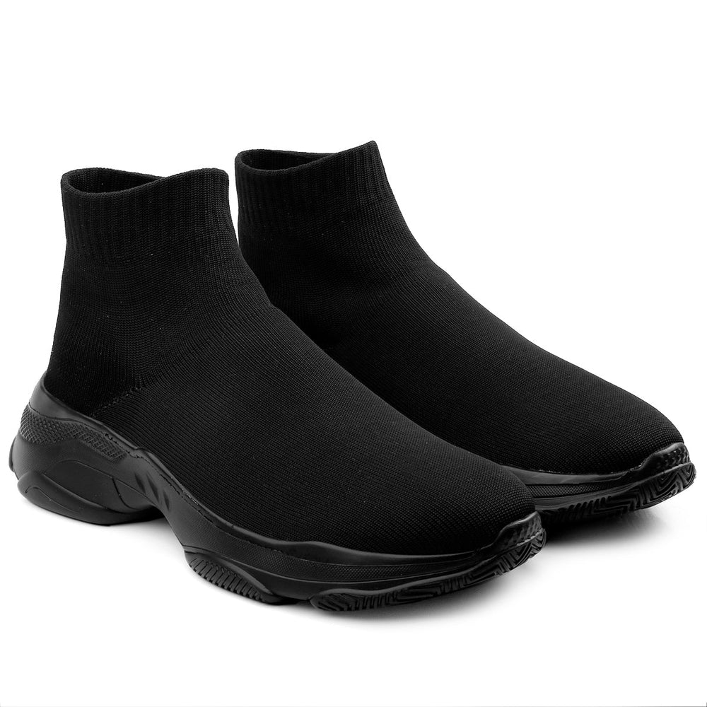 Pair of black sock boots on a white background
