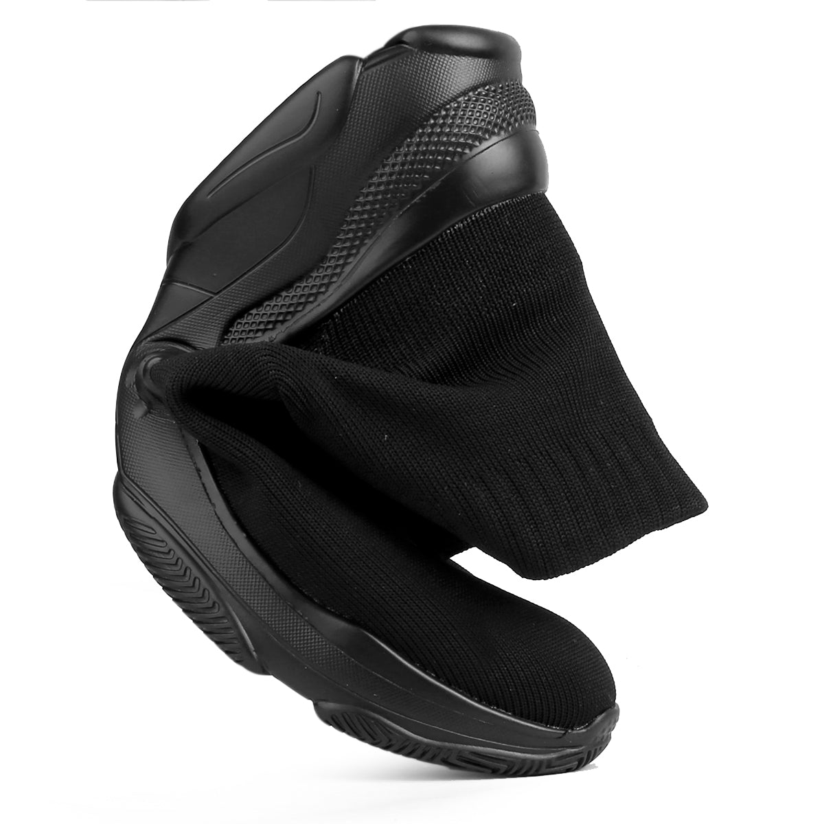 Black ankle boot with sock on a white background