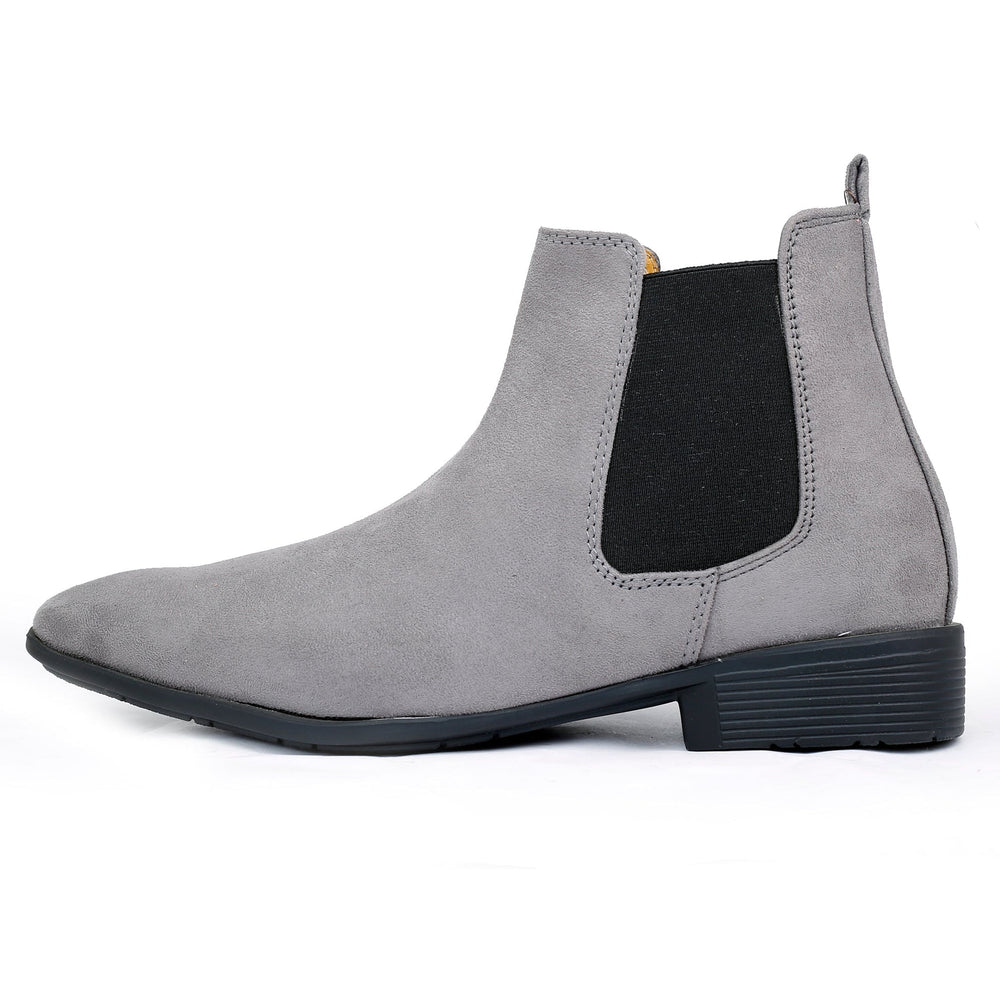 Gray Chelsea boot with black patch on a white background