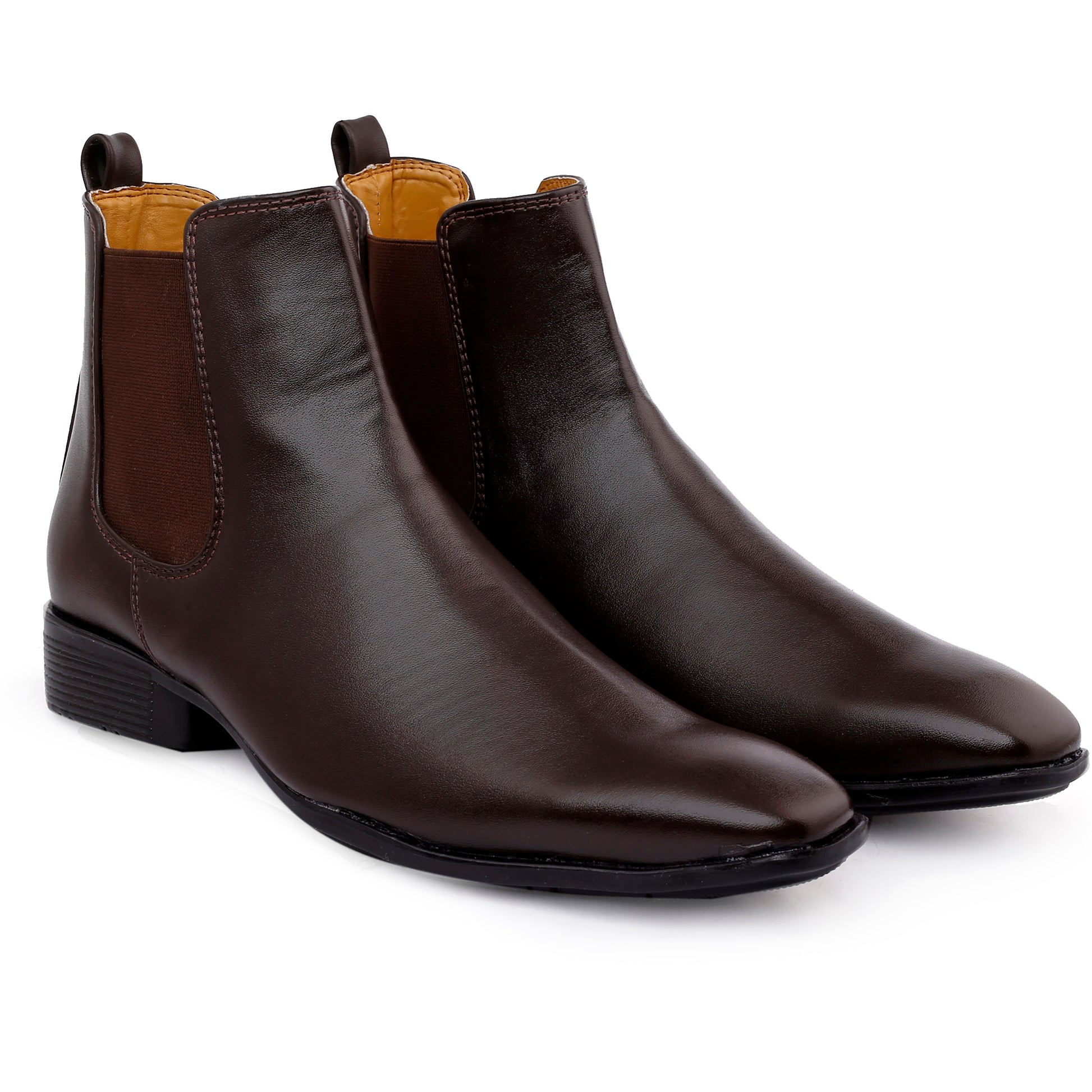 Pair of brown leather Chelsea boots on a white background