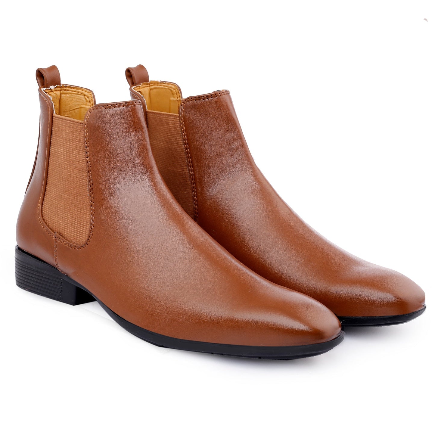 Pair of brown leather Chelsea boots on a white background
