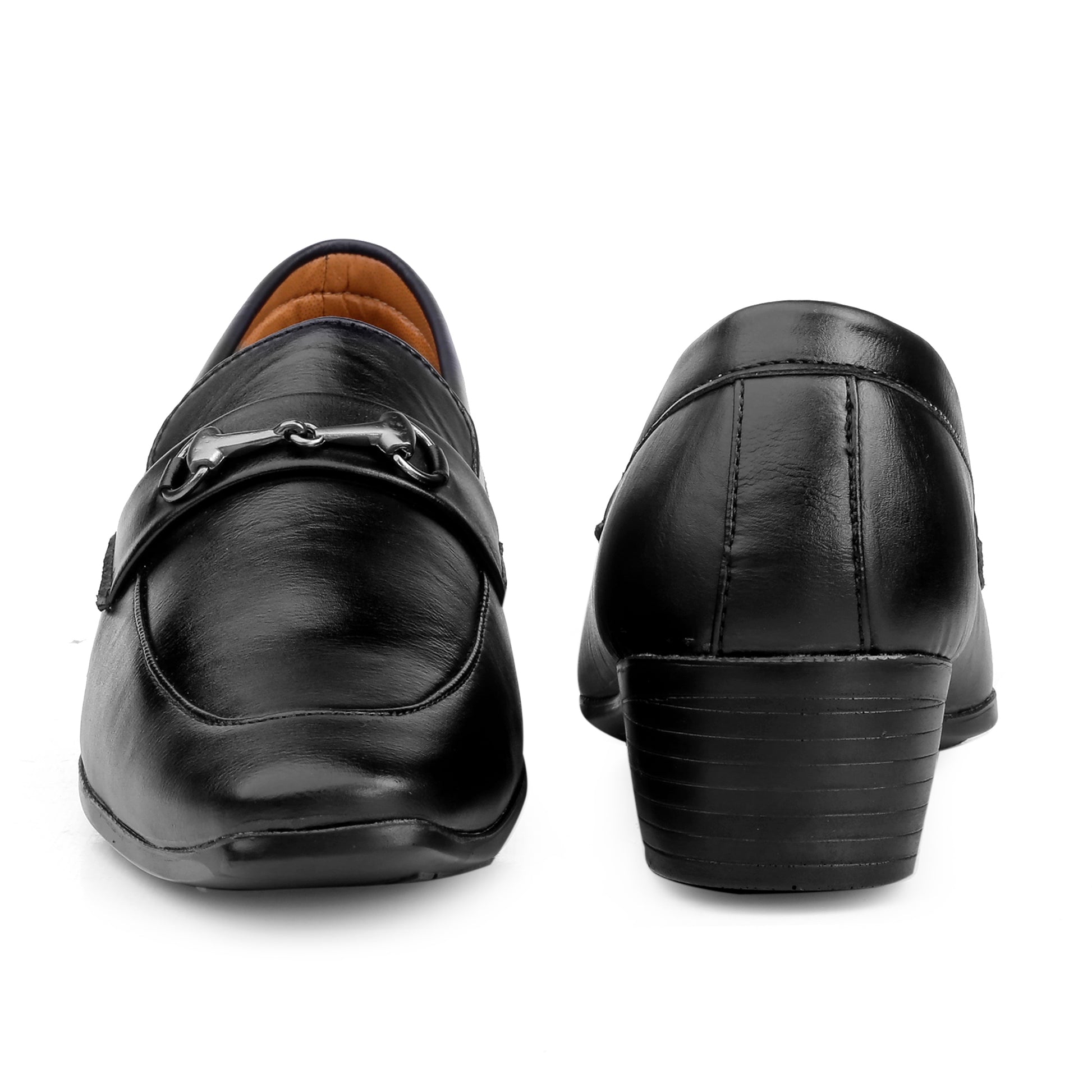 Black leather loafers with a metallic buckle on a white background