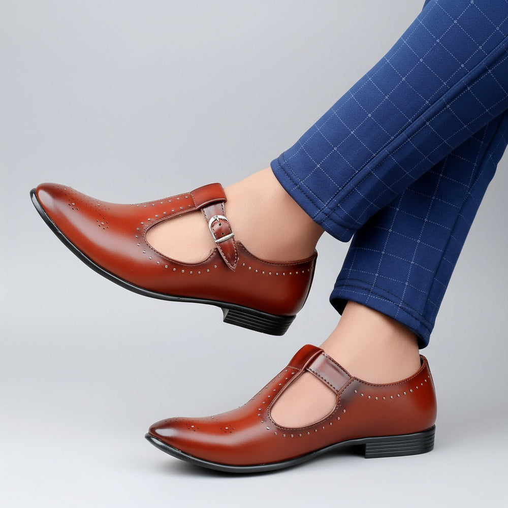 Brown leather shoes worn with blue checkered pants on a wooden floor.