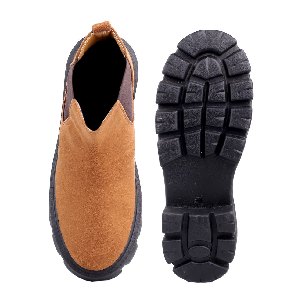 Brown slip-on shoe with black sole on a white background