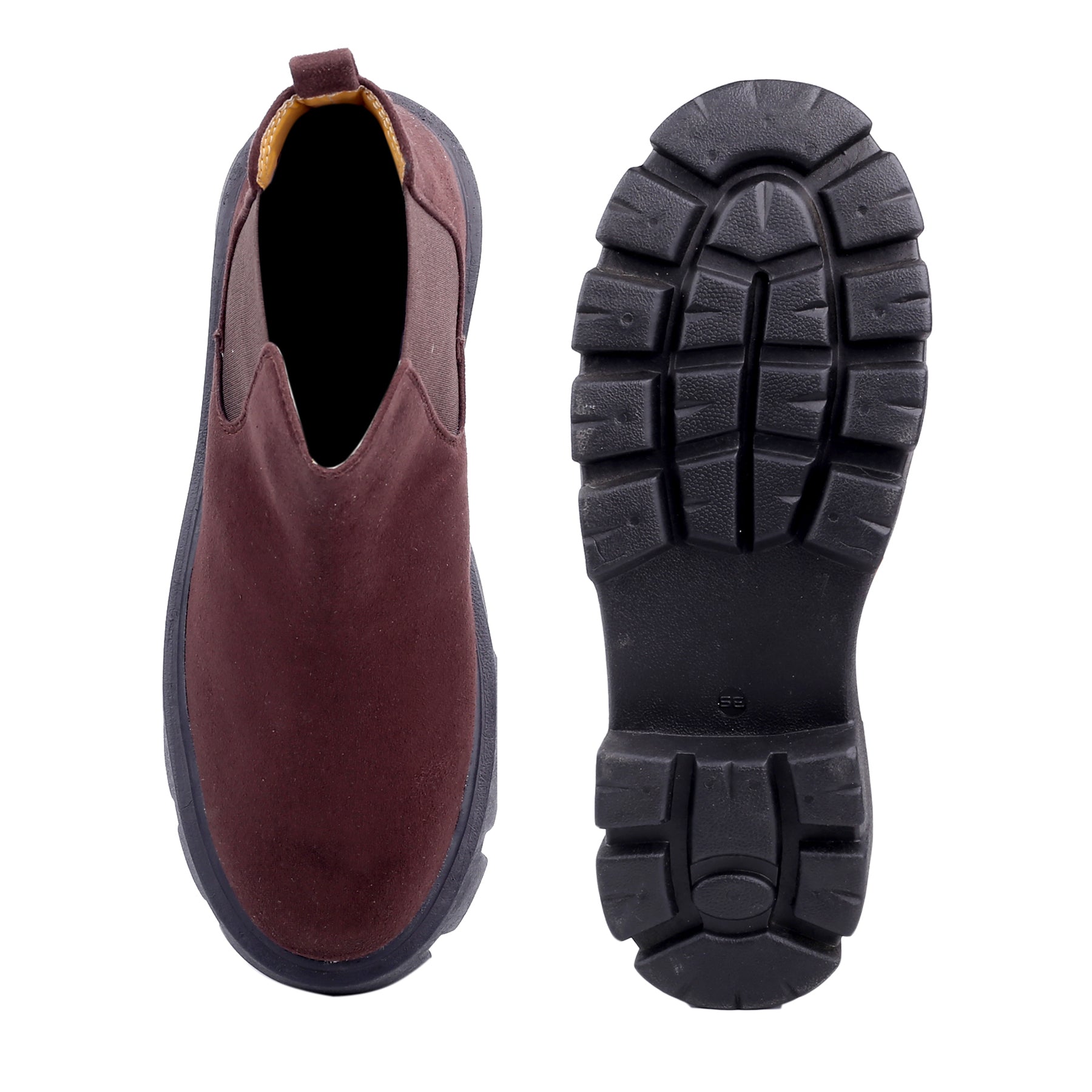 Brown slip-on boot with black sole on a white background