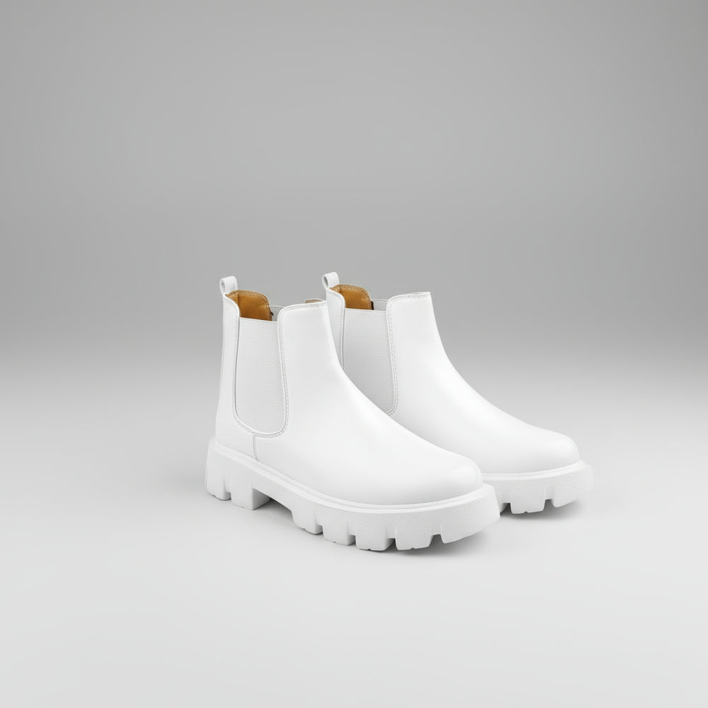 Pair of white Chelsea boots on a white background