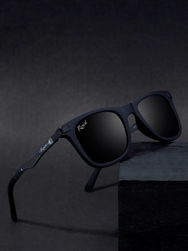 Black sunglasses with 'Rebel' branding on a dark background