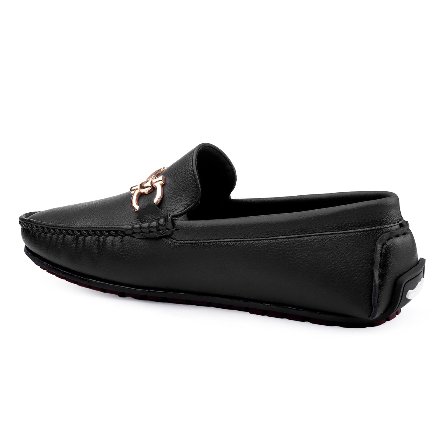 Black loafer with a rose gold buckle on a white background