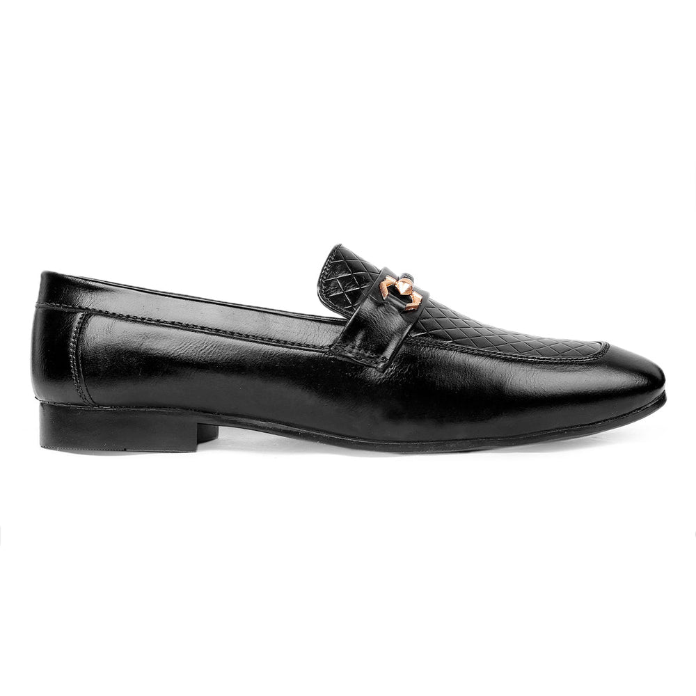 Black leather loafer with a decorative buckle on a white background