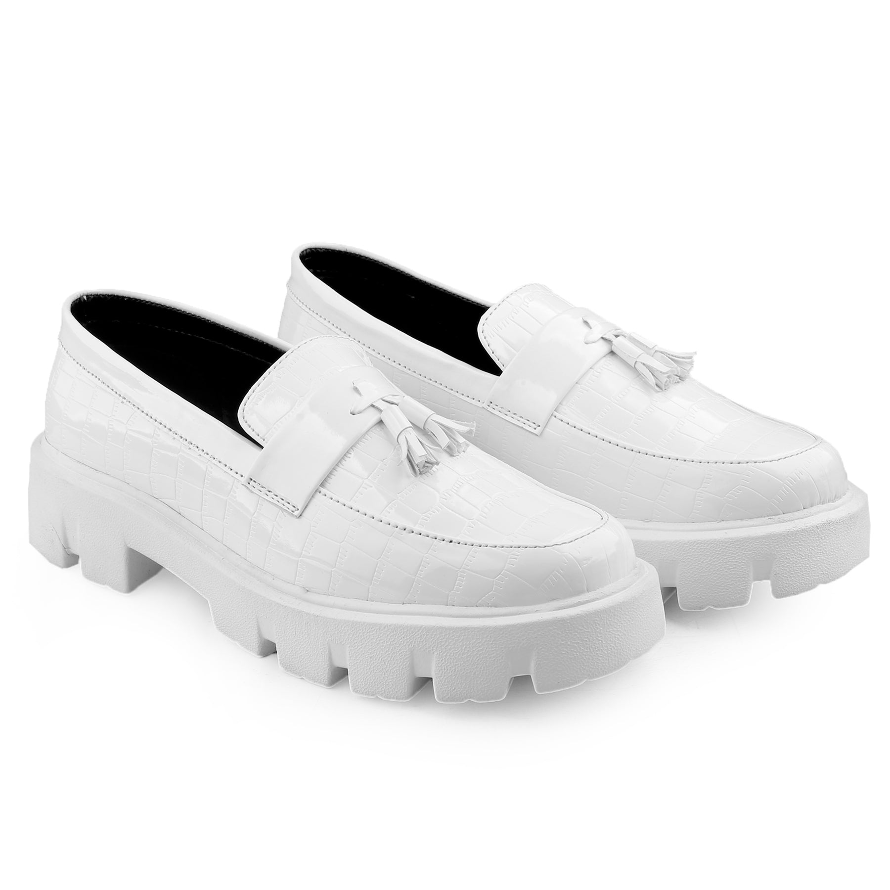 White loafers with chunky soles on a white background