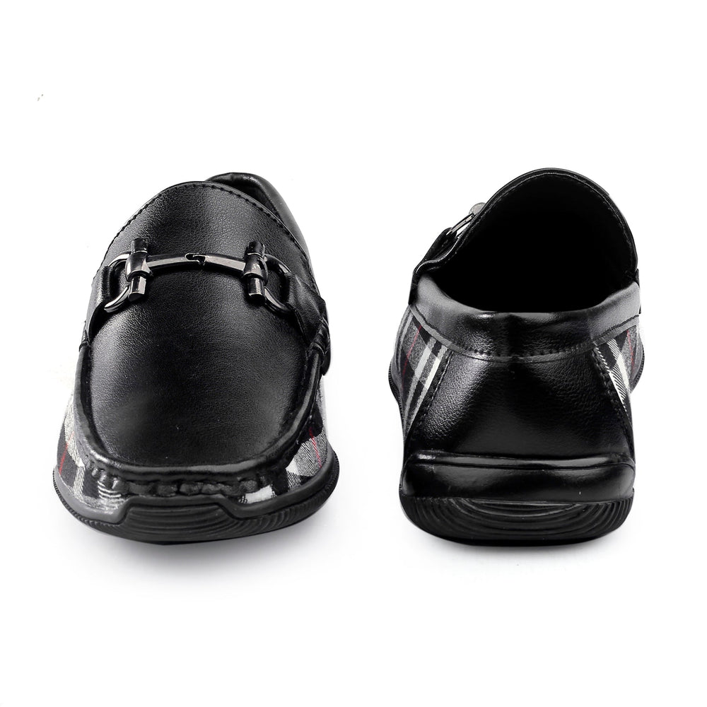 Black shoes with a buckle on a white background