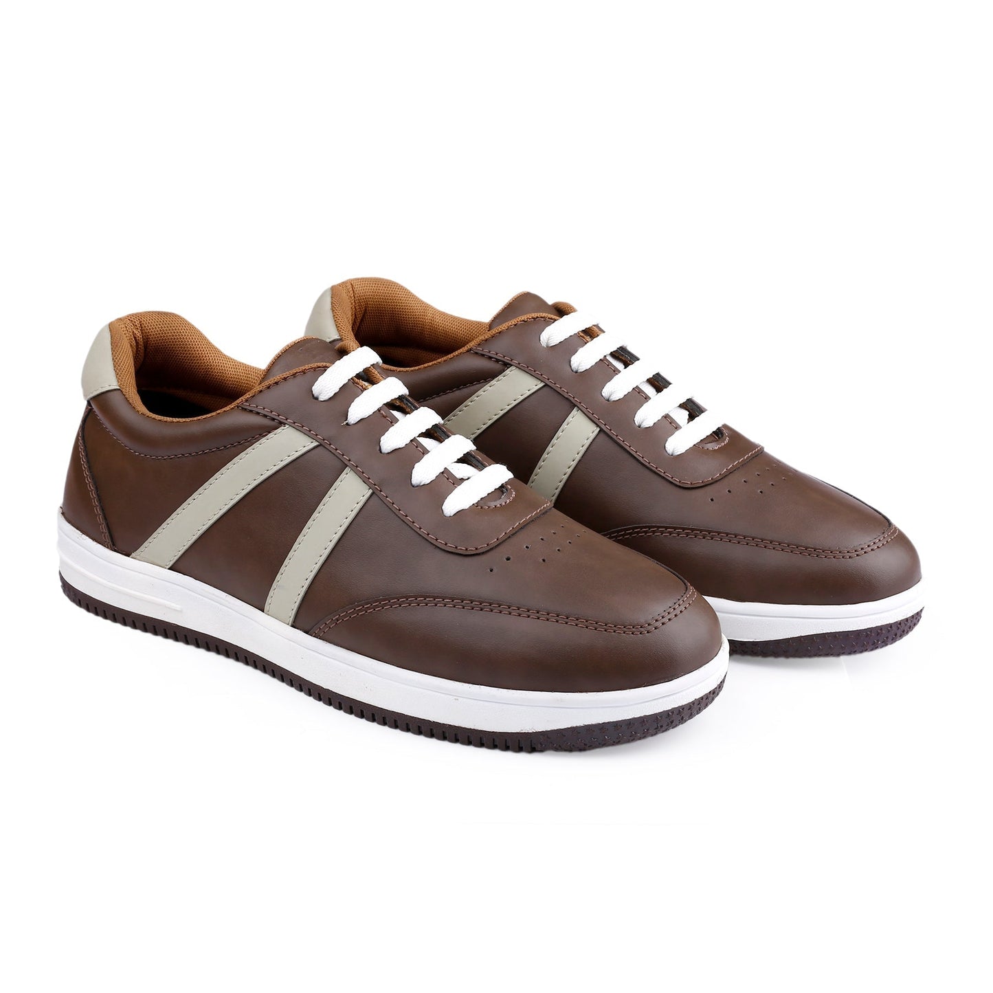 Pair of brown sneakers with white laces on a white background