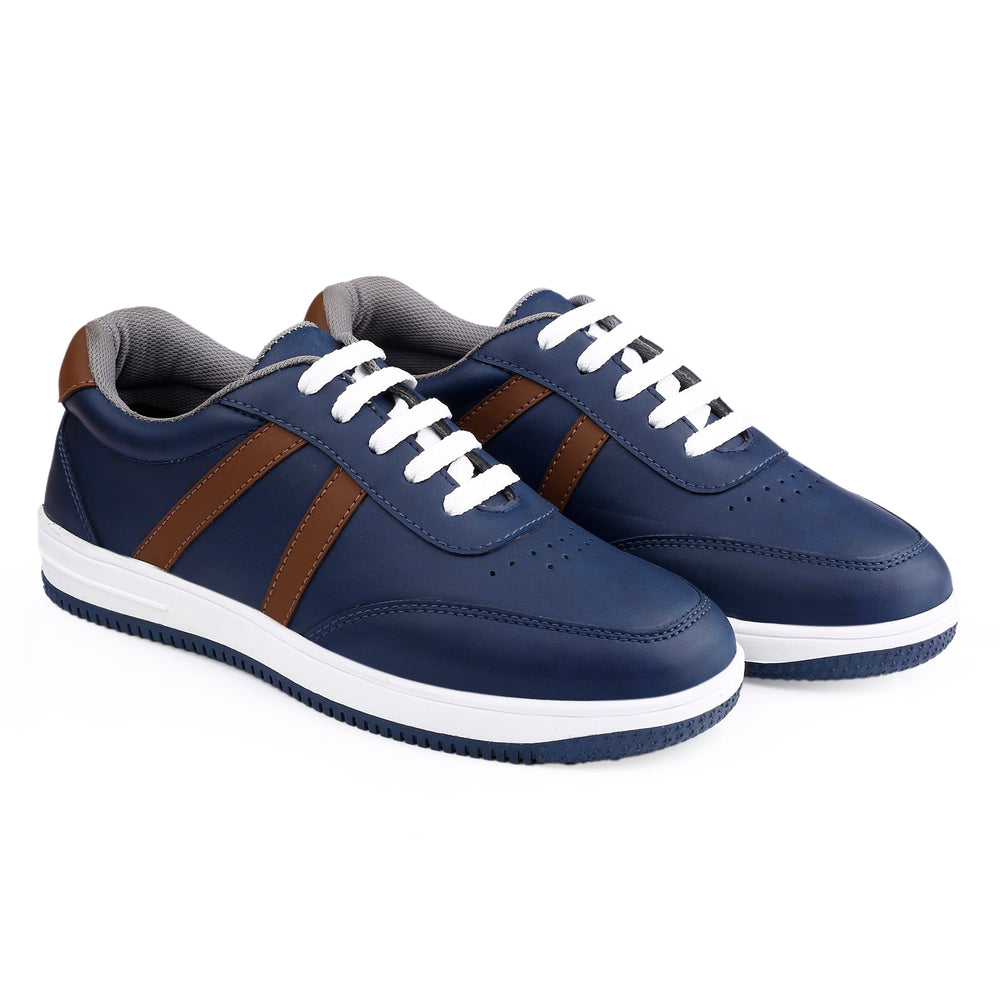 Pair of blue sneakers with brown accents on a white background