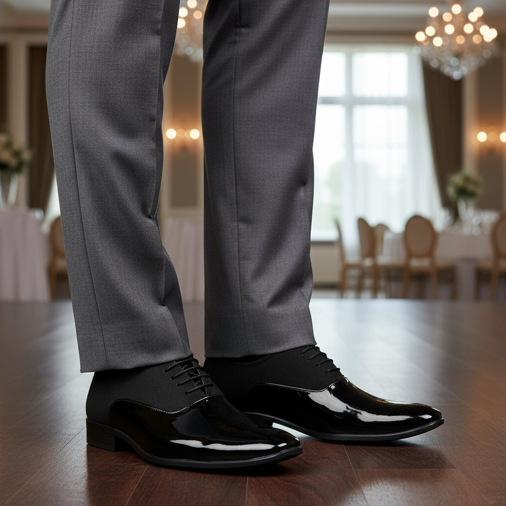 Black dress shoes with glossy finish on a white background