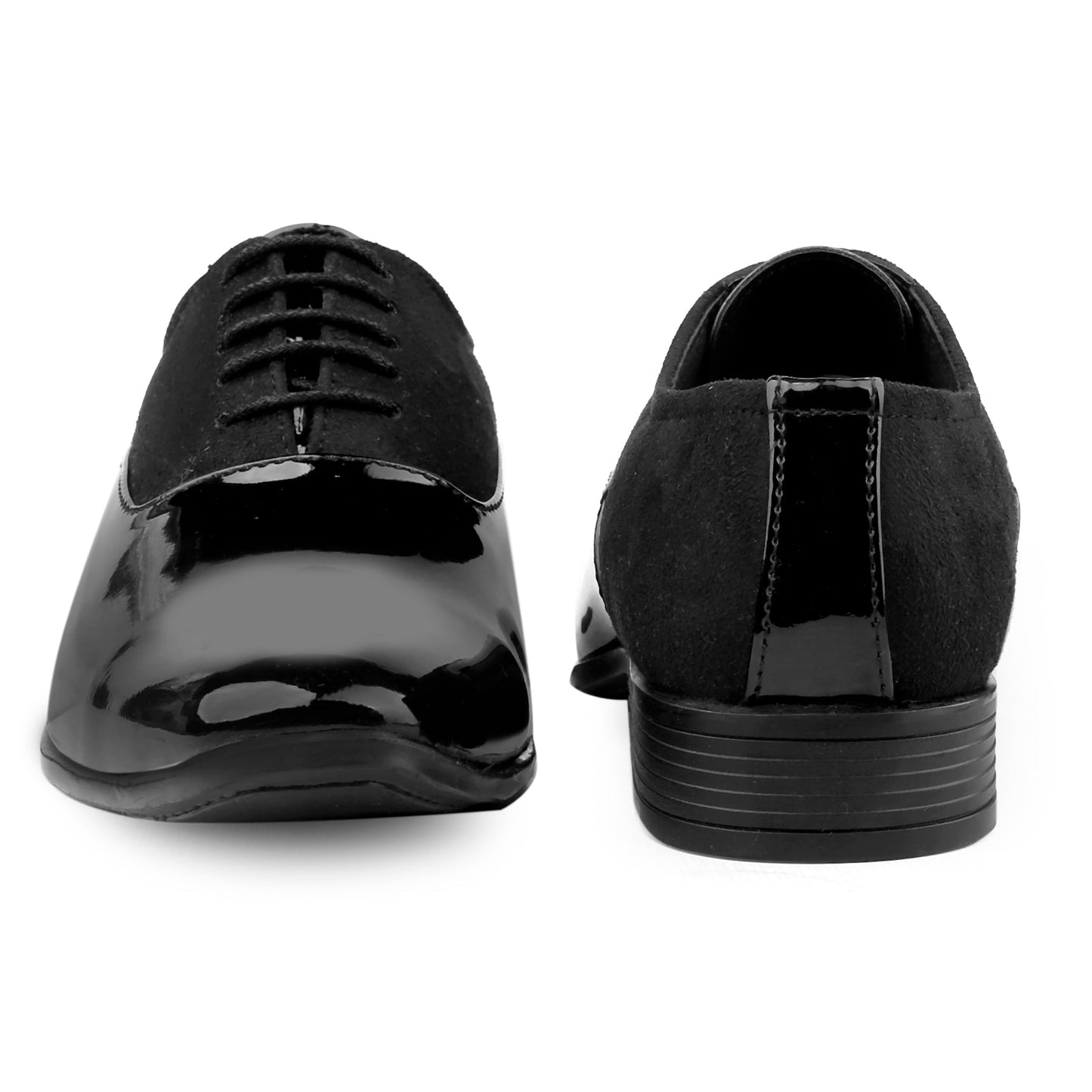 Black patent leather shoes on a white background