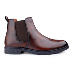 Brown leather Chelsea boot on a white background
