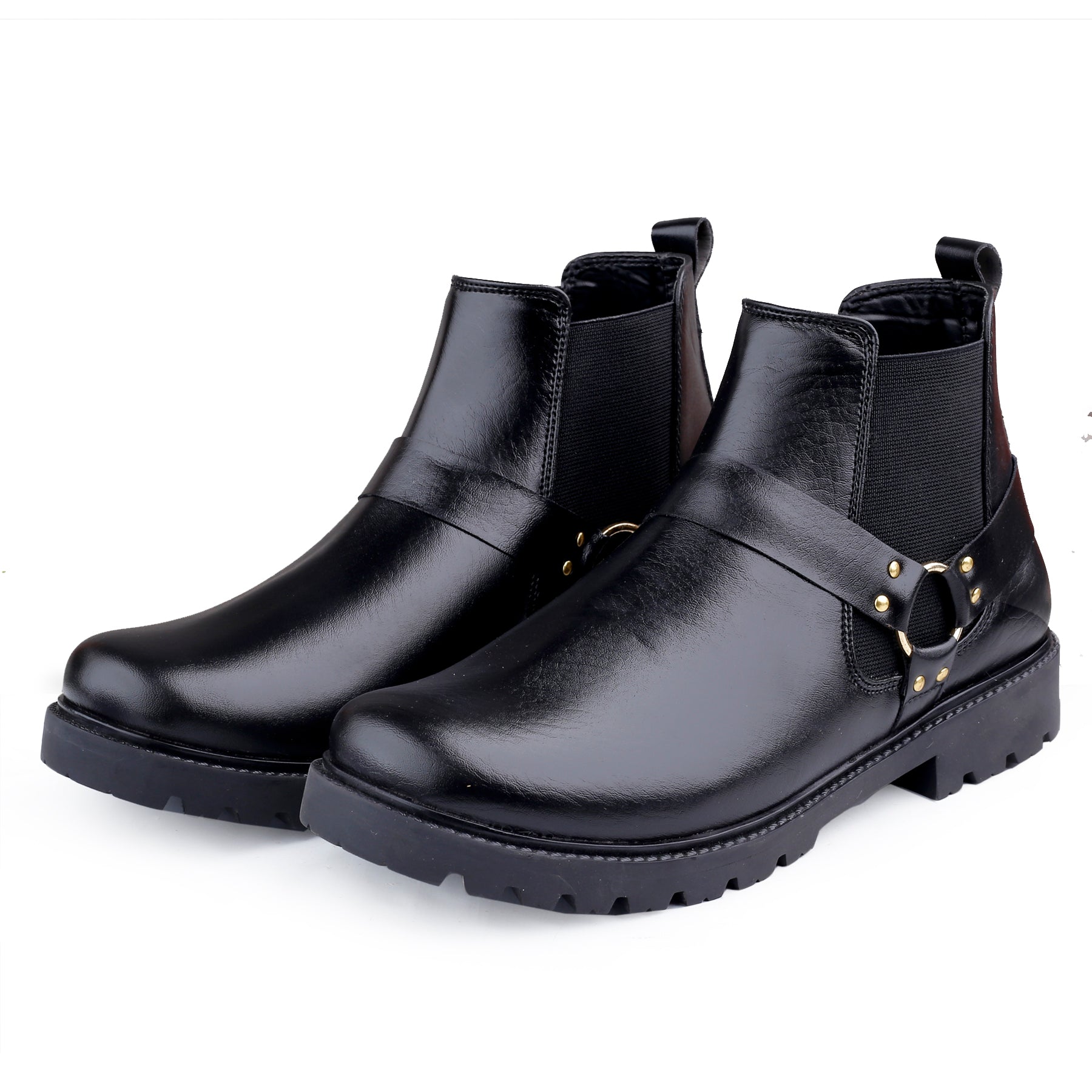 Pair of black leather boots with gold buckles on a white background