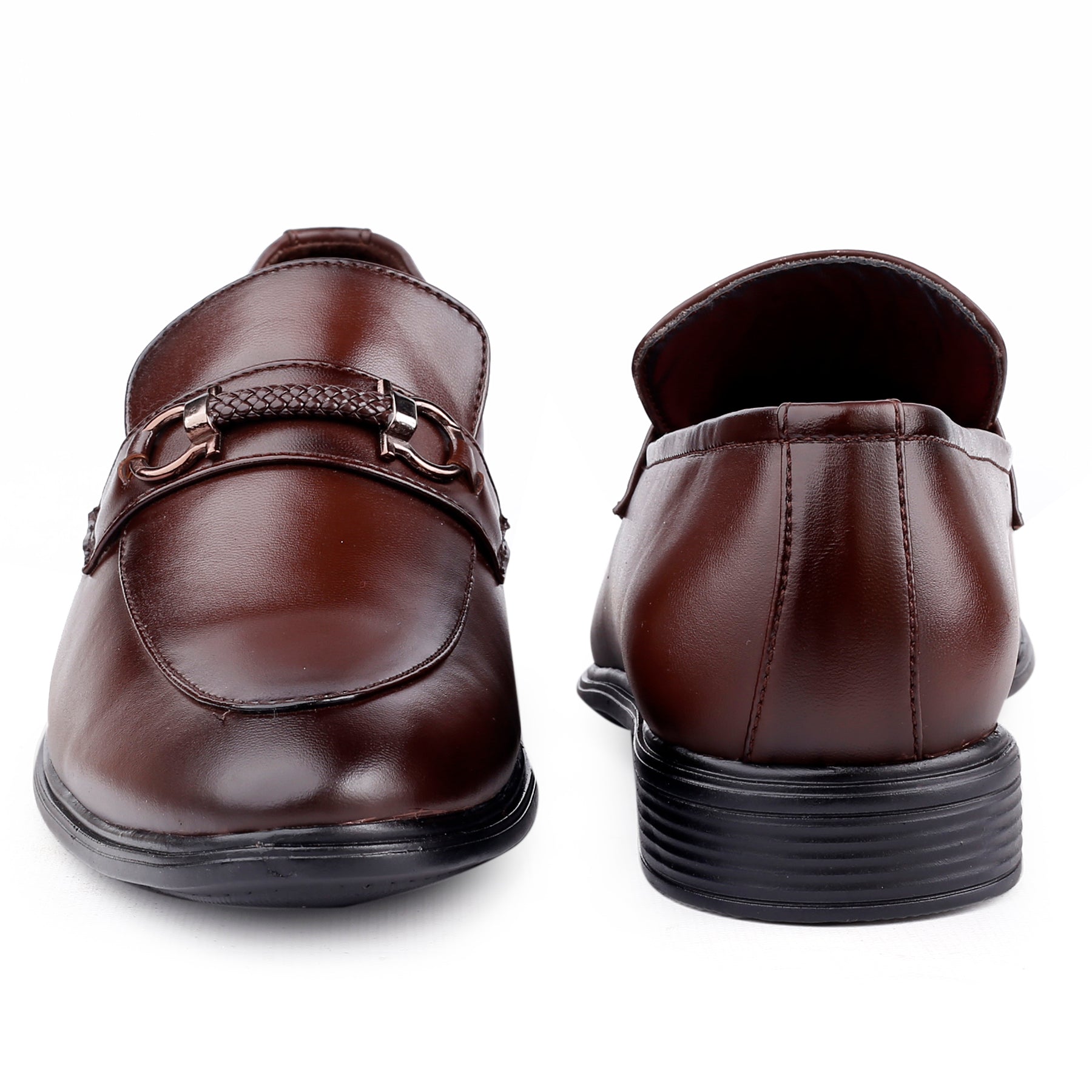 Pair of brown leather shoes with a buckle on a white background