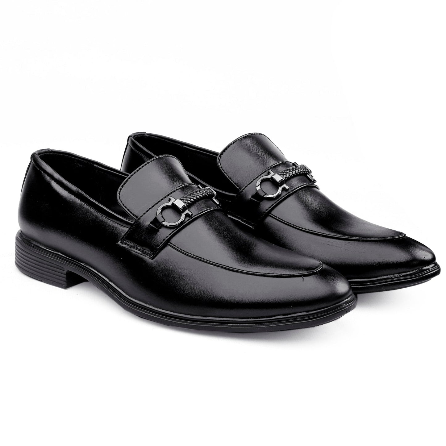 Pair of black dress shoes with a silver buckle on a white background