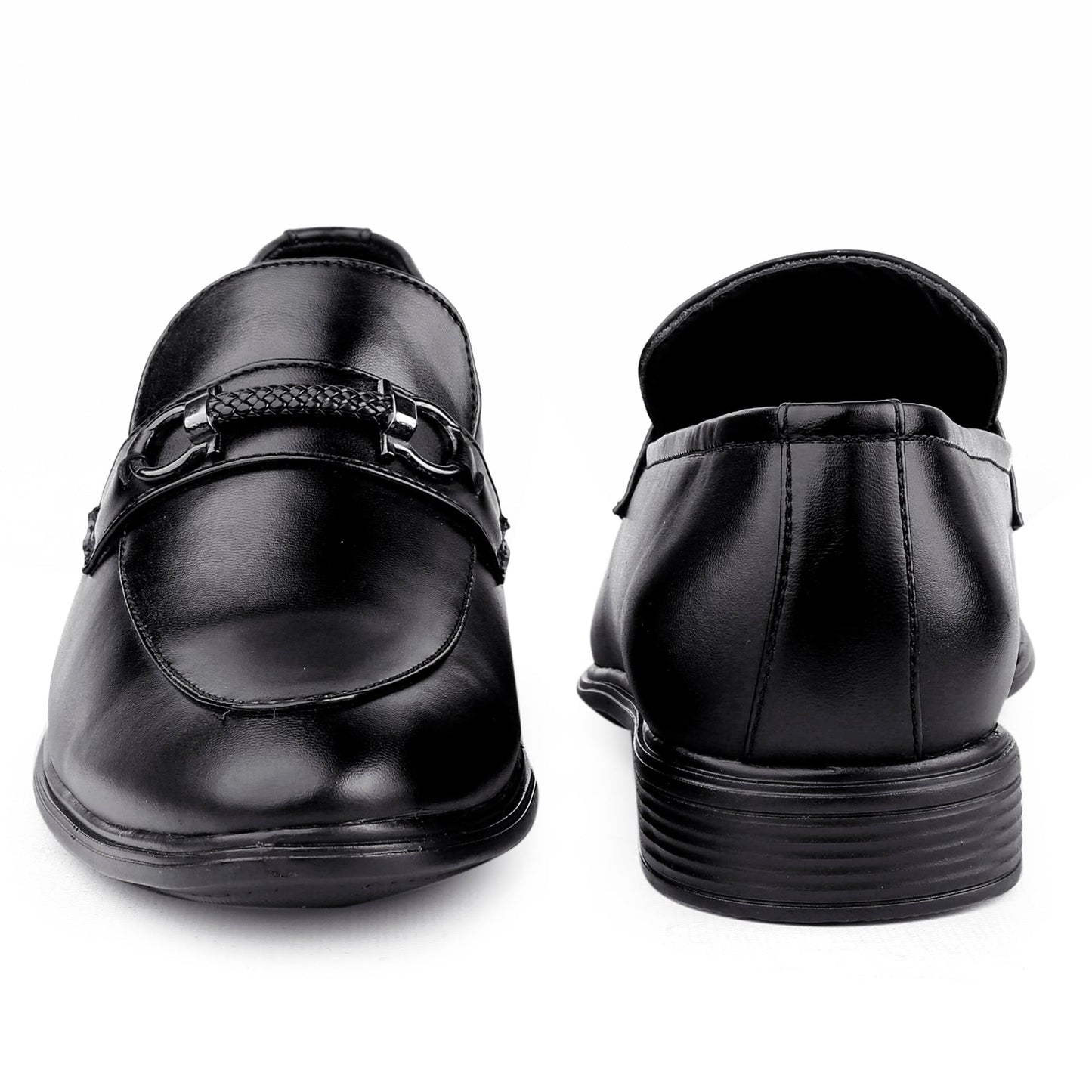 Black dress shoes with a buckle on a white background