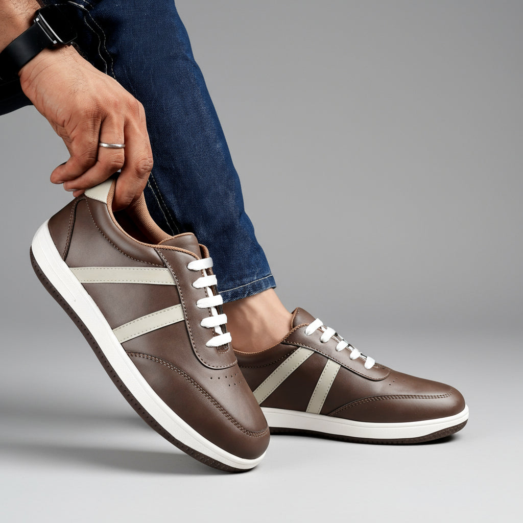 Brown sneakers with white stripes worn by a person on a black background