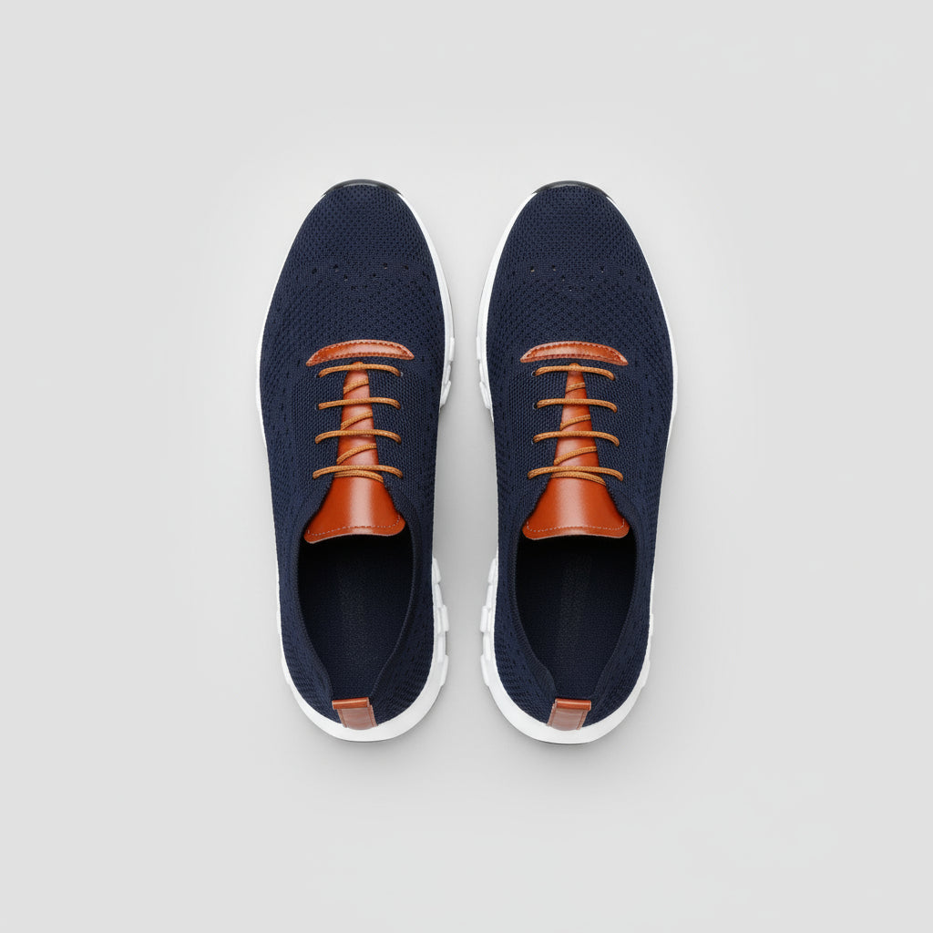 Navy and orange sneakers on a wooden floor