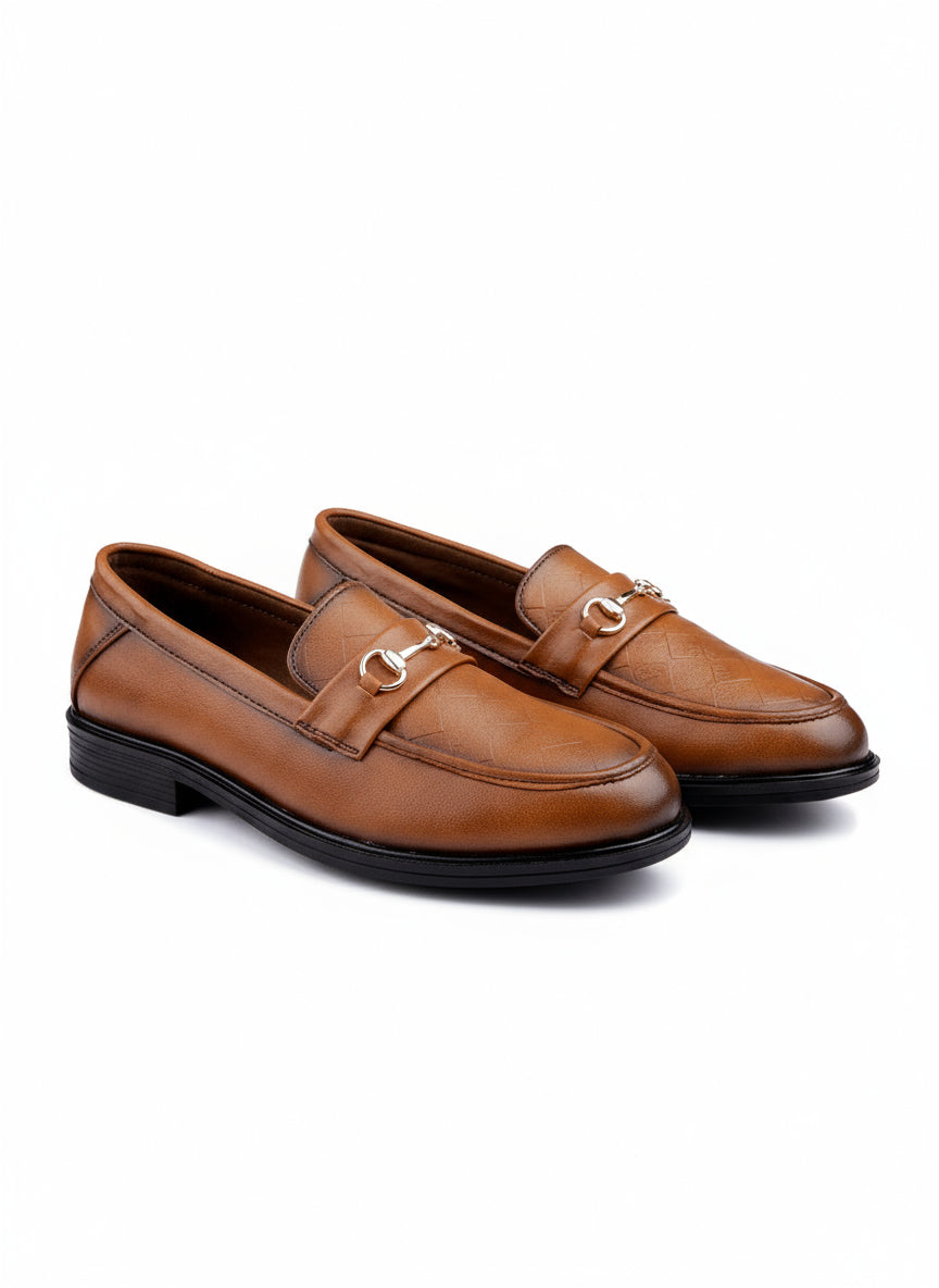 Pair of brown loafers with gold buckles on a white background