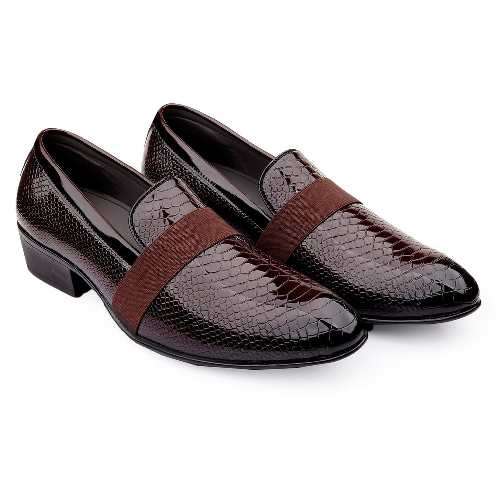 Pair of brown leather loafers with snake skin pattern on a white background
