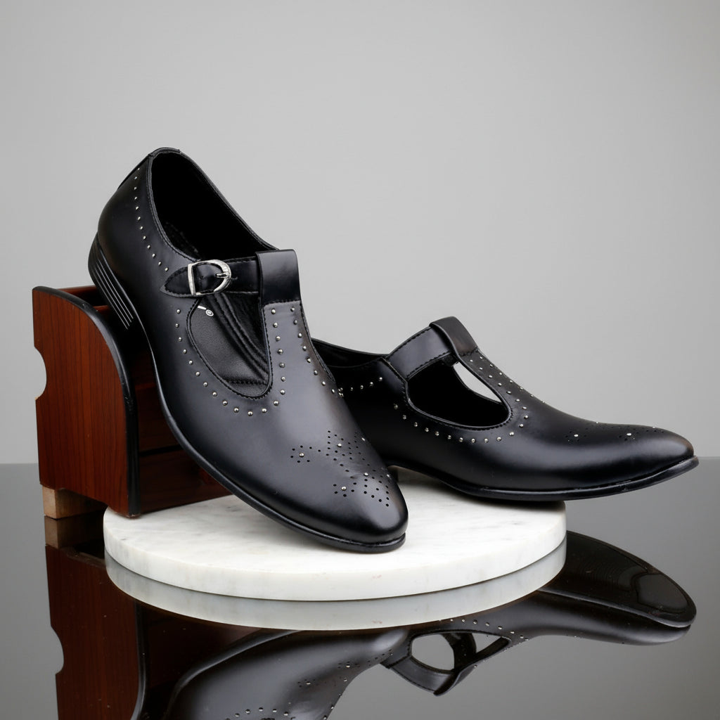 Pair of black shoes on a white platform with a blurred indoor background