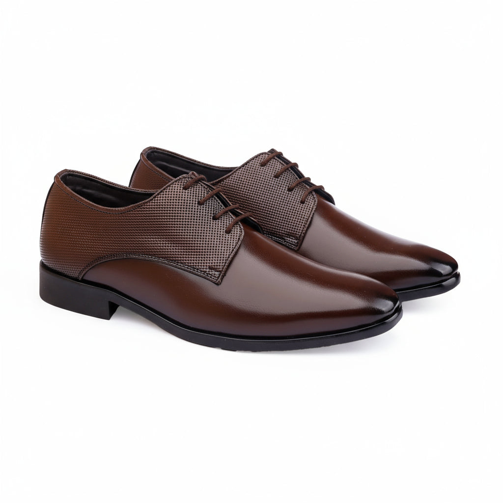 Pair of brown dress shoes on a white background