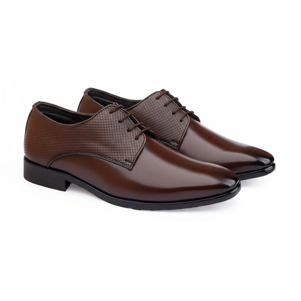 Pair of brown dress shoes on a white background