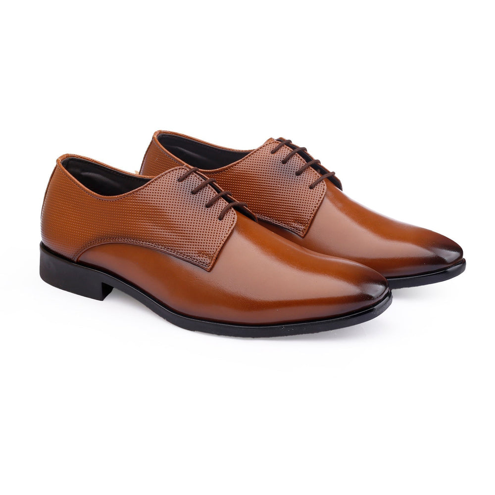 Pair of brown leather dress shoes on a white background
