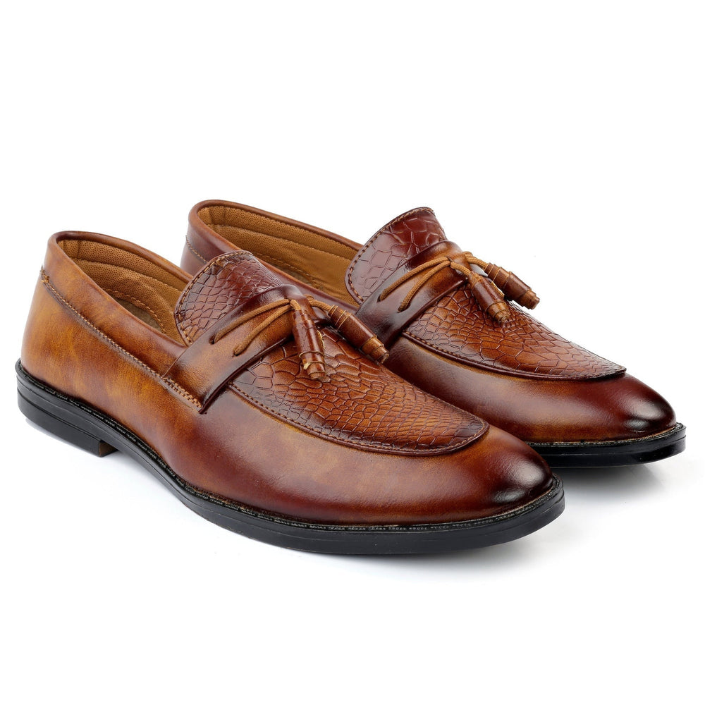 Pair of brown leather loafers with tassels on a white background