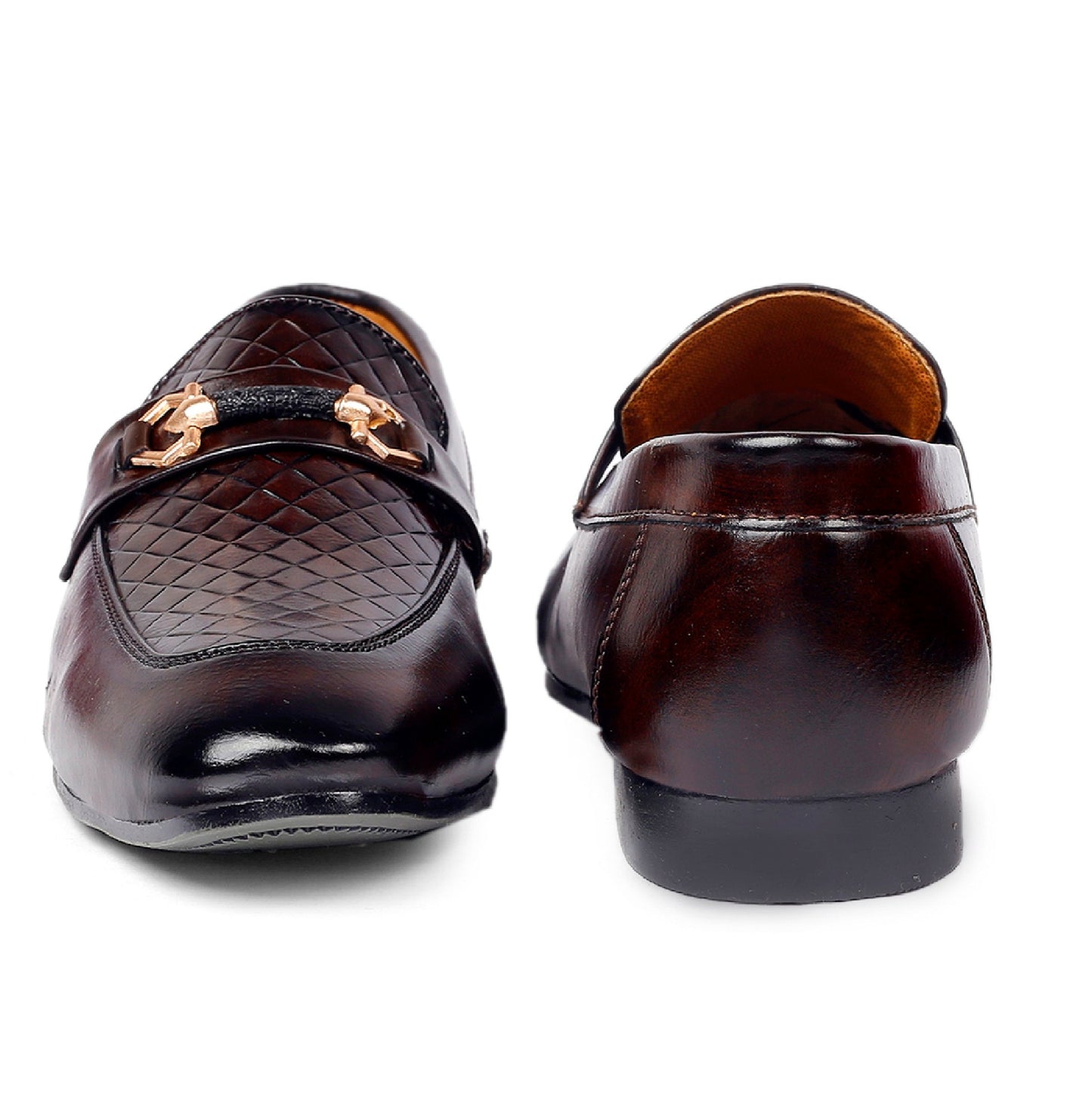 Pair of brown leather loafers with gold accents on a white background