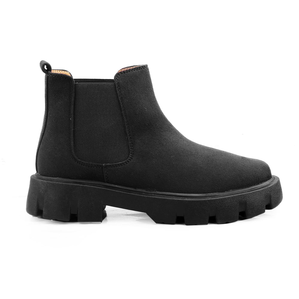 Black Chelsea boot on a white background