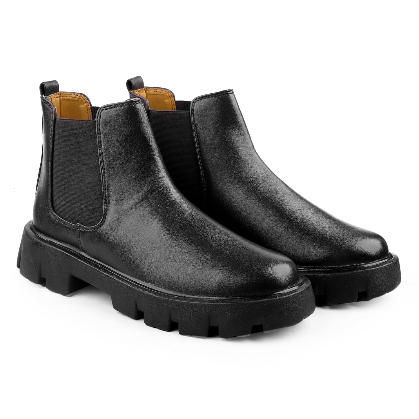 Pair of black leather Chelsea boots on a white background