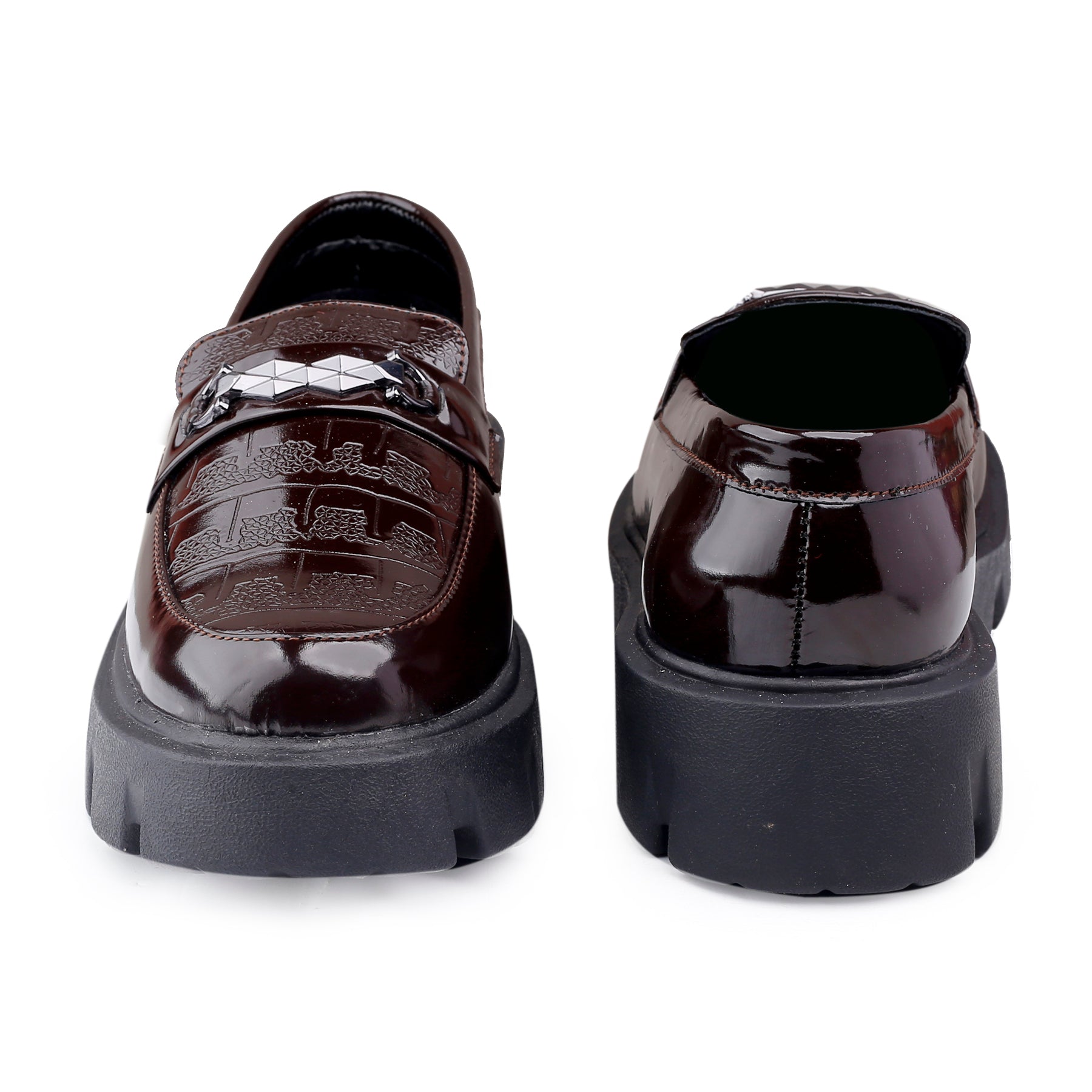 Pair of brown loafers with platform sole on a white background
