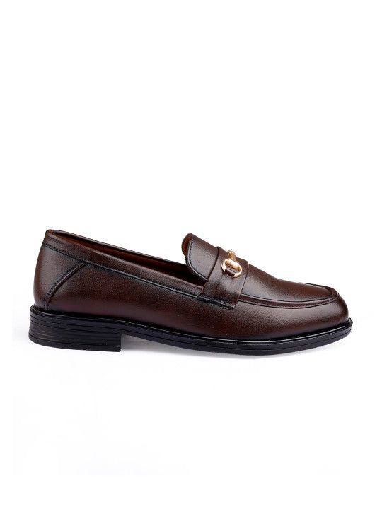 Brown leather loafer with gold buckle on a white background